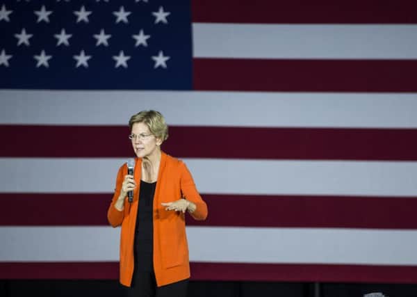 US President contender Elizabeth Warren took out a Facebook ad falsely claiming Mark Zuckerberg had endorsed Donald Trump to highlight social medias fake news problem (Picture:  Zach Gibson/Getty Images)