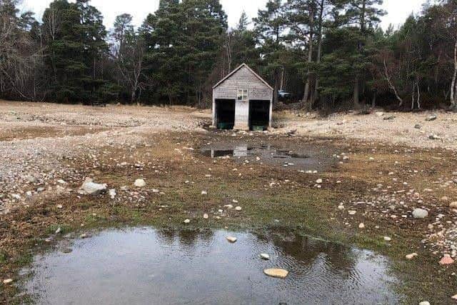 The boathouse near the emptied loch, where fishing was impossible last year. Picture: swns