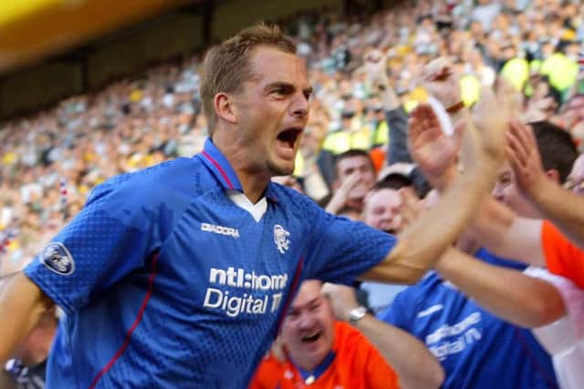 Ronald de Boer celebrates a goal against Celtic in an Old Firm clash at Celtic Park
