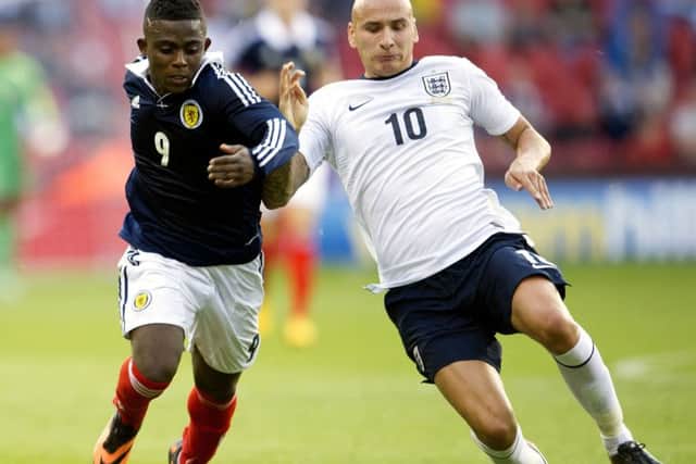 Islam Feruz takes on Jonjo Shelvey in an under-21 friendly between Scotland and England at Bramall Lane in Sheffield in 2013. Picture: Bill Murray/SNS