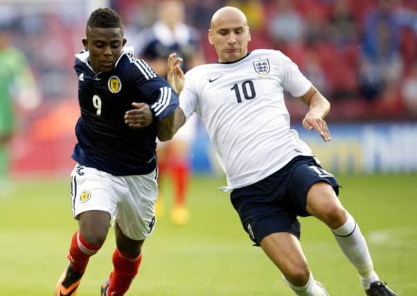 Islam Feruz takes on Jonjo Shelvey in an under-21 friendly between Scotland and England at Bramall Lane in Sheffield in 2013. Picture: Bill Murray/SNS