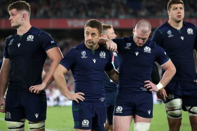 Dejection at the final whistle following defeat by Japan. But the numbers just dont stack up for Scotland. Picture: PA.