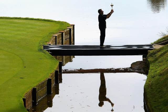 Sam Torrance raises the Ryder Cup at the Belfry after captaining the Europe team to victory in 2002.  Photograph: Jamie Squire/Getty