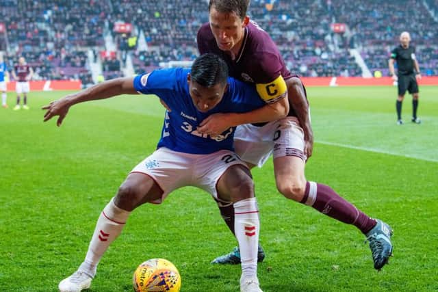 Rangers' Alfredo Morelos shields the ball from Christophe Berra during last season's match against Hearts at Tynecastle. Picture: SNS
