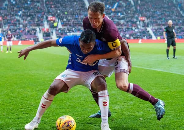 Rangers' Alfredo Morelos shields the ball from Christophe Berra during last season's match against Hearts at Tynecastle. Picture: SNS