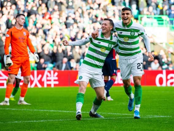 Goalscorers James Forrest and Mohamed Elyounoussi celebrate