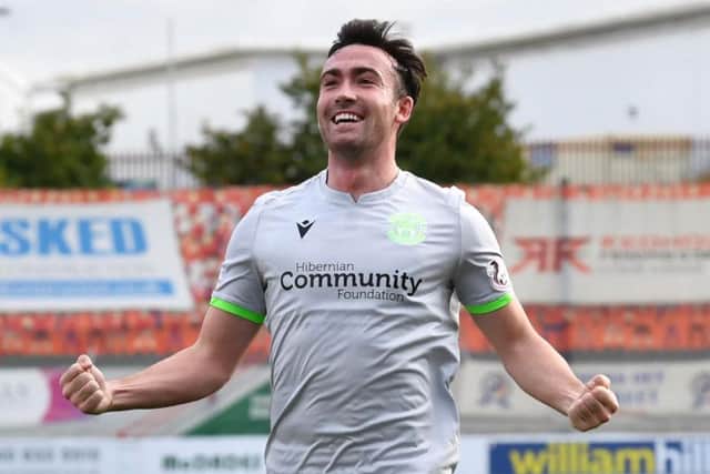 Stevie Mallan celebrates his first-half strike, but Hibs' wait for a second league win goes on