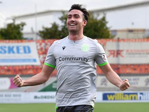 Stevie Mallan celebrates his first-half strike, but Hibs' wait for a second league win goes on