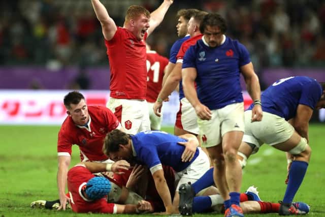 Wales celebrate as they win a topsy-turvy quarter-final with France