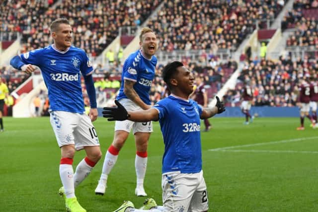 Alfredo Morelos celebrates his equaliser in front of the Hearts fans