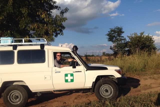 Dr Gavin McColl driving to a remote rural area in Zambia.