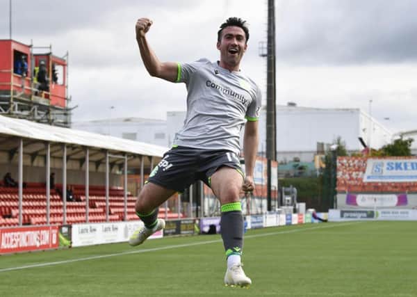 Stevie Mallan celebrates his first-half volley, putting Hibs in front. Picture: SNS.