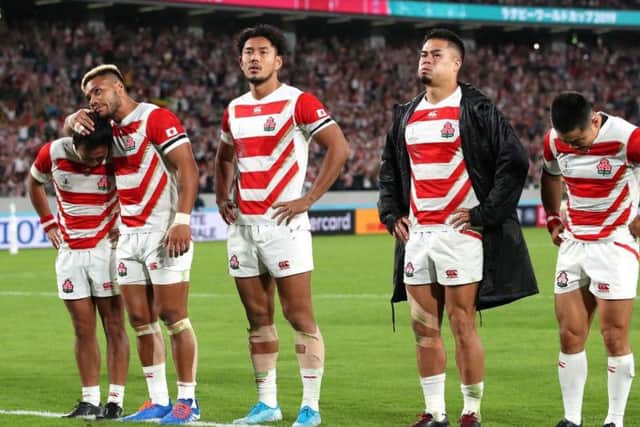 Yutaka Nagare, Lomano Lemeki, Ryohei Yamanaka, Yu Tamura and Fumiaki Tanaka of Japan are dejected at the final whistle