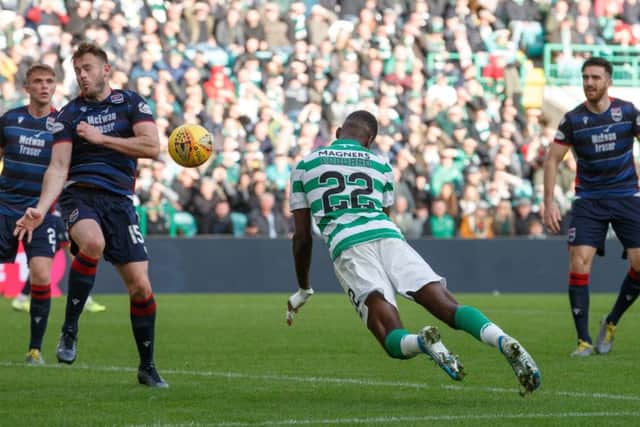 Odsonne Edouard dives to score Celtics fourth in the 6-0 rout of Ross County on Saturday. Picture: PA