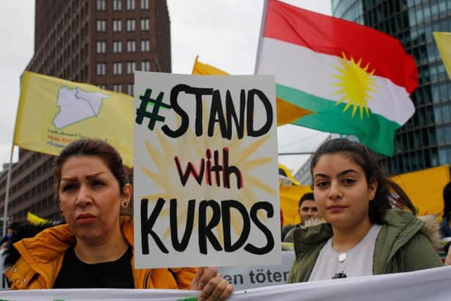 Kurdish protesters and their supporters hold a demonstration against Turkey's military intervention in northern Syria in Berlin. (Picture: David Gannon/AFP via Getty Images)