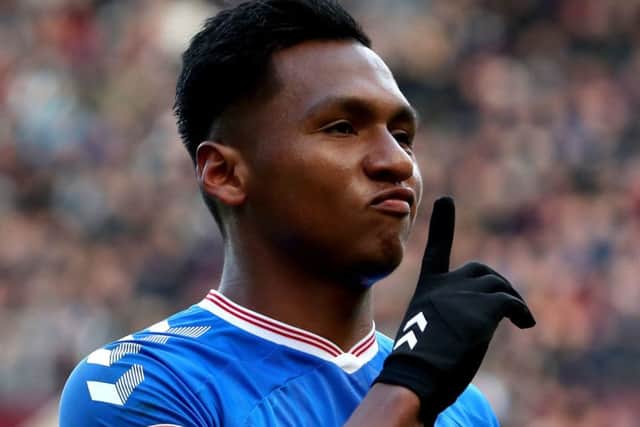 Alfredo Morelos celebrates his equaliser in front of the Hearts supporters. Picture: Jane Barlow/PA