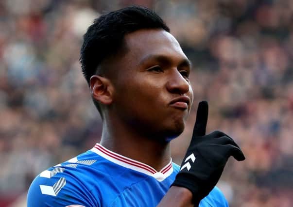 Alfredo Morelos celebrates his equaliser in front of the Hearts supporters. Picture: Jane Barlow/PA