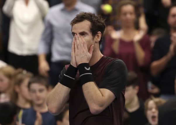Andy Murray seems scarcely able to believe that he has beaten Stan Wawrinka to lift the European Open trophy. Picture: Francisco Seco/AP