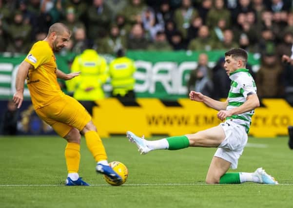 Celtic's Ryan Christie slides into a challenge on Livingston's Scott Robinson which earned a straight red card. Picture: Alan Harvey/SNS