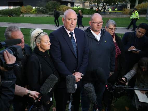 Spokesman Radd Seiger for the family of Harry Dunn, flanked by mother Charlotte Charles and father Tim Dunn, speaking to the media. Picture: PA