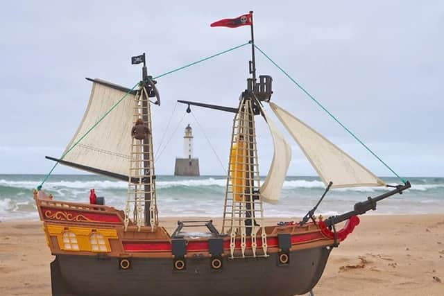 The toy pirate ship before eight-year-old Ollie Ferguson and sibling Harry, five set it on its way to Scandanavia.