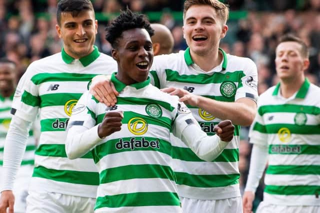 Jeremie Frimpong celebrates James Forrest's goal in the 6-0 victory over Ross County on Saturday. Picture: SNS