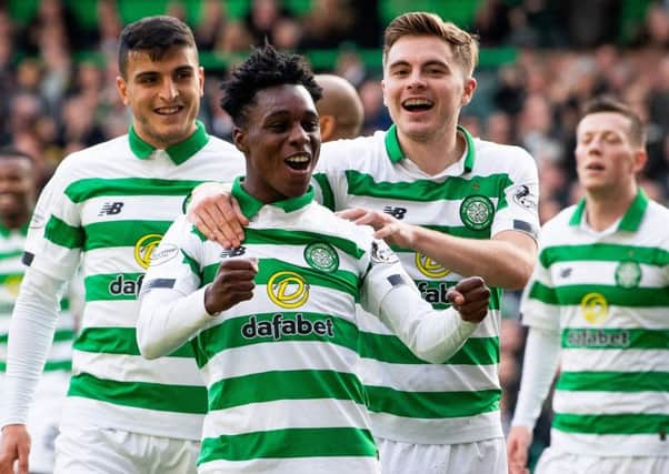 Jeremie Frimpong celebrates James Forrest's goal in the 6-0 victory over Ross County on Saturday. Picture: SNS