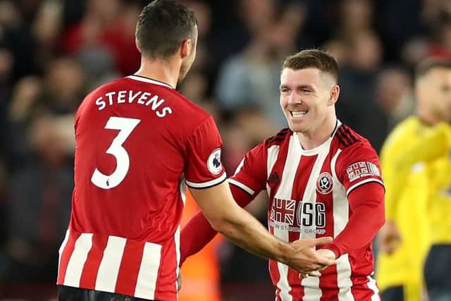 Sheffield United's Enda Stevens, left, and John Fleck celebrate after their 1-0 victory over Arsenal.