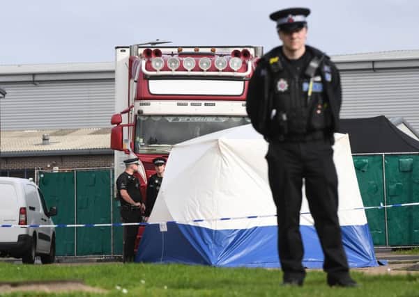 Police guard a lorry at the Waterglade Industrial Park in Grays, Essex, after 39 bodies were found inside (Picture: Stefan Rousseau/PA Wire)