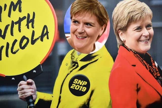 First Minister Nicola Sturgeon poses next to a trade stand at the SNP party conference in Aberdeen