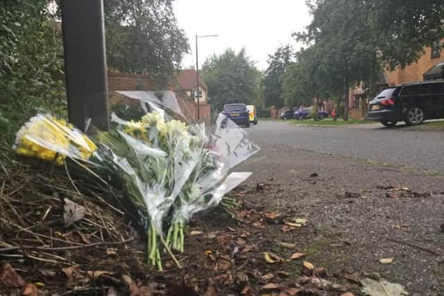 Flowers laid near the scene of the stabbings in Milton Keynes