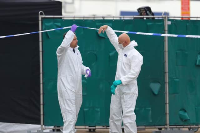 Forensic officers at the scene. Picture: PA