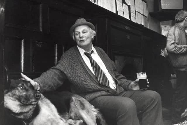 Hamish Henderson with his dog Sandy, pictured in an Edinburgh pub in 1989. He died in 2002. PIC: TSPL.
