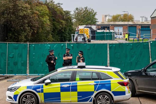 Police guard Waterglade Industrial Park in Grays, Essex, where 39 people were found dead in the back of a lorry. (Picture: SWNS)