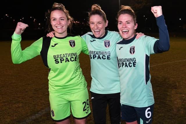 Lee Alexander, Leanne Ross and Jo Love celebrate Glasgow City's 13th title in a row. Picture: John Devlin