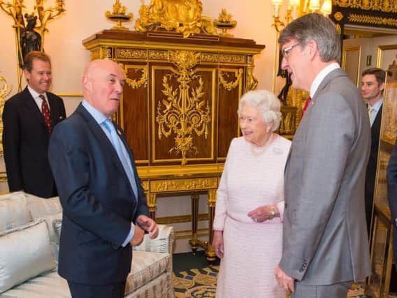 British Red Cross executives, including Michael Adamson (far right) meet the Queen