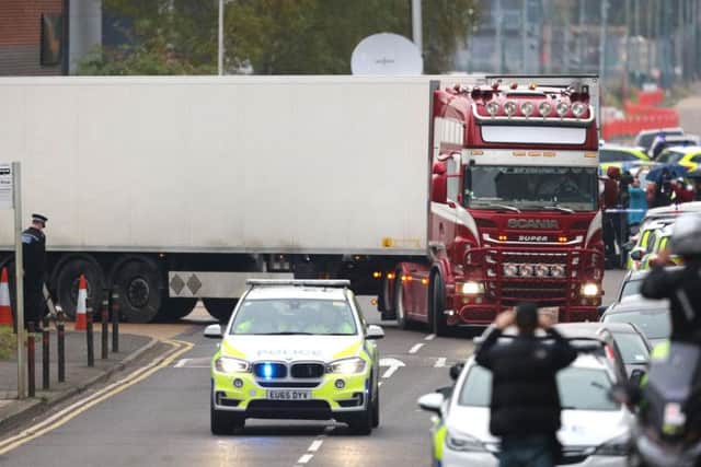 The container lorry in which 39 bodies were found leaves Waterglade Industrial Park in Grays, Essex