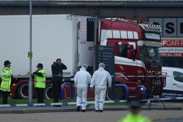 Forensics attend to the container lorry in which 39 bodies were found at Waterglade Industrial Park in Grays, Essex