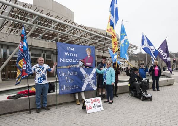Are people flocking to join pro-independence campaigners like these outside Holyrood parliament? (Picture: Andrew O'Brien)
