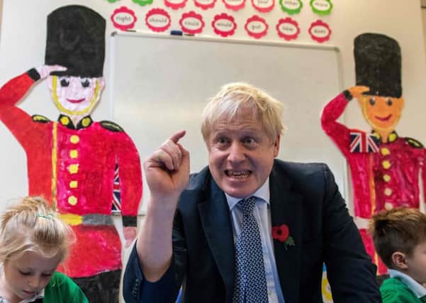 Boris Johnson, on a visit to a primary academy in Bury St Edmunds, has driven out Tory moderates (Picture: Chris J Ratcliffe/Pool/AFP via Getty Images)