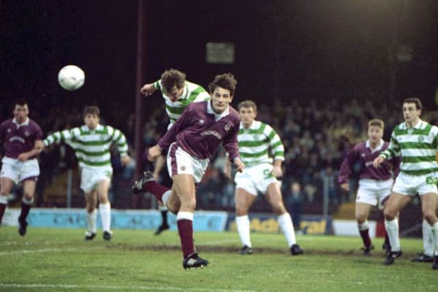 Craig Levein in typically combative action while contesting a header for Hearts against Celtics Tony Cascarino during a match at Tynecastle in 1992. Picture: TSPL.