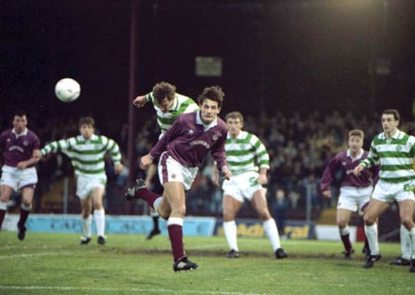 Craig Levein in typically combative action while contesting a header for Hearts against Celtics Tony Cascarino during a match at Tynecastle in 1992. Picture: TSPL.