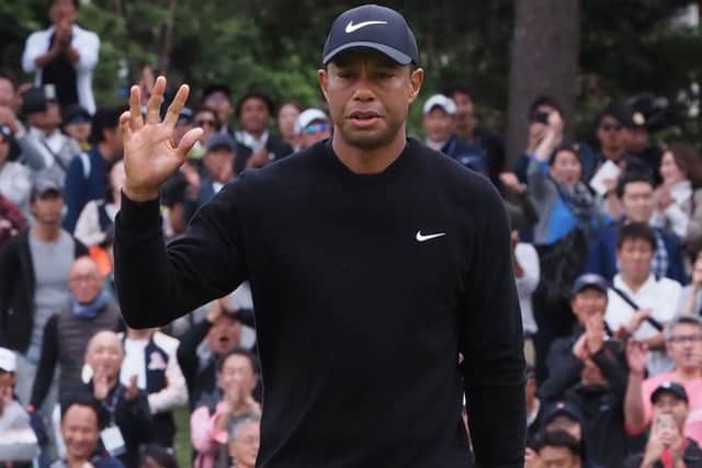 Tiger Woods acknowledges the fans on the 5th green in the first round of the Zozo Championship. Picture: Toshifumi Kitamura/AFP/Getty