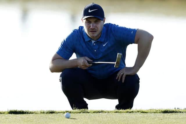 Oliver Fisher lines up a putt on the 11th green on day one of the Portugal Masters. Picture: Luke Walker/Getty