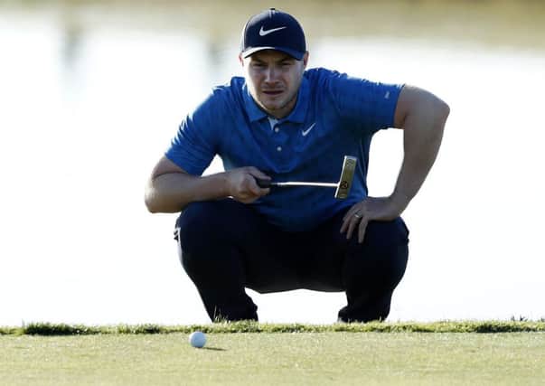 Oliver Fisher lines up a putt on the 11th green on day one of the Portugal Masters. Picture: Luke Walker/Getty