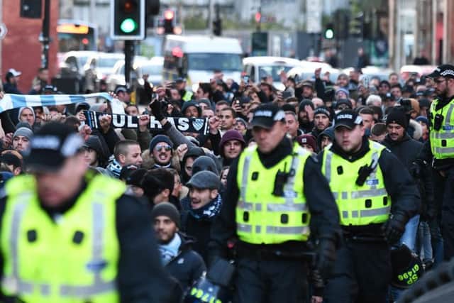 Lazio supporters are escorted to Celtic Park. Picture John Devlin