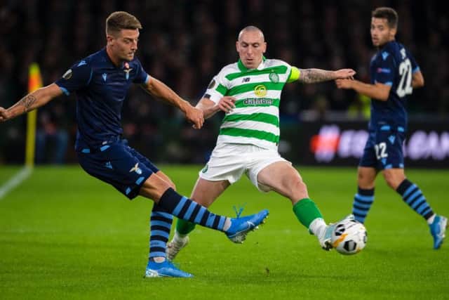 Celtic's Scott Brown holds off Lazio's Sergej Milinkovic-Savic