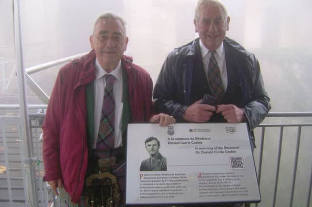 Tom Caskie (left) and his brother Gordon with a memorial plaque marking the work of Rev Dr Donald Caskie which has been unveiled at Fort de la Revere near Nice. PA Photo