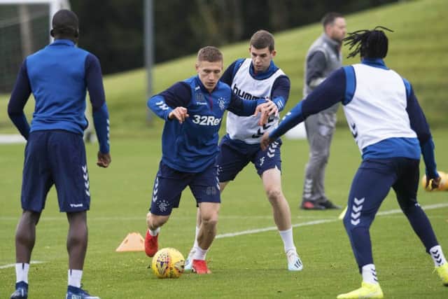 Greg Docherty, left, and Jon Flanagan take part in a Rangers training session at the Hummel Training Centre. Picture: SNS.