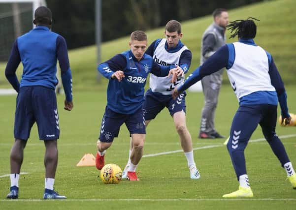Greg Docherty, left, and Jon Flanagan take part in a Rangers training session at the Hummel Training Centre. Picture: SNS.